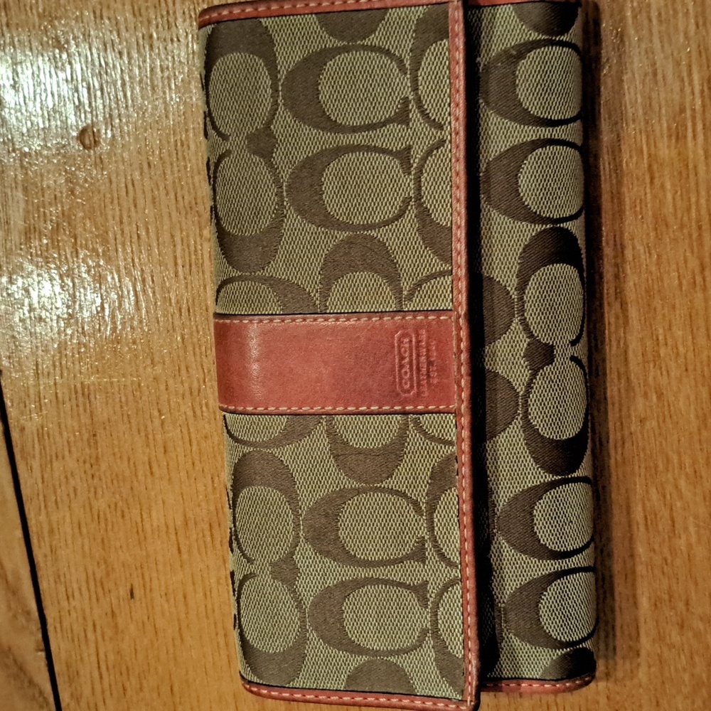 Brown Coach wallet with orange trim